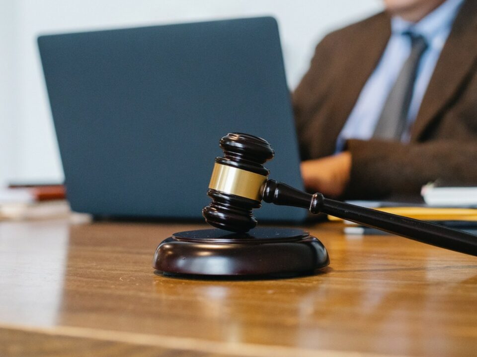 a labor law judge working on laptop at desk
