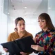 Employees discussing workplace concerns related to gender identity discrimination in a New York office